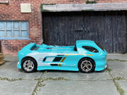 Custom Hot Wheels Deora II aqua blue with white, black, and gold graphics with chrome wheels and rubber tires - side view