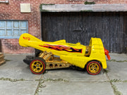 Custom Hot Wheels Dogfighter yellow aircraft-inspired body with black and red flame graphics with gold wheels with redline tires and rubber tires - side view