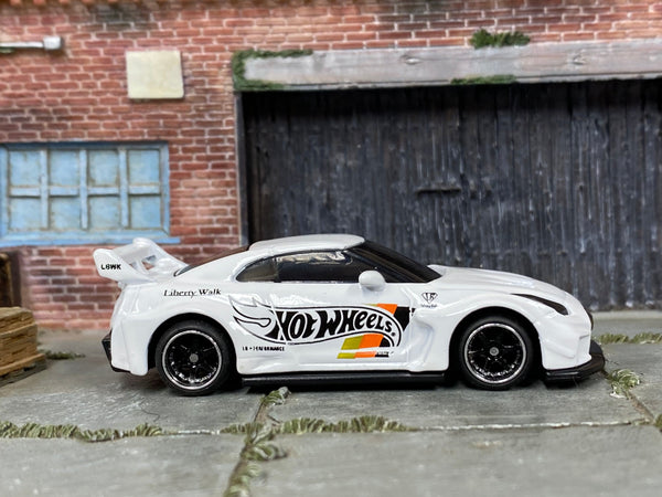 Custom Hot Wheels LB Silhouette Works GT Nissan 35GT-RR in white with black and chrome 6-spoke wheels and rubber tires