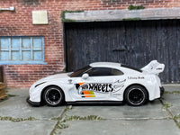 Custom Hot Wheels LB Silhouette Works GT Nissan 35GT-RR in white with black and chrome 6-spoke wheels and rubber tires
