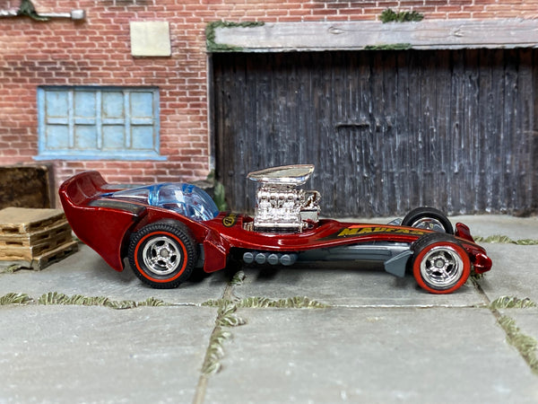 Madfast metallic-red custom Hot Wheels with chrome wheels and redline rubber tires, view 1