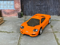 McLaren F1 custom Hot Wheels, elevated front view showing dark glazing and lamp graphics