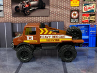 Brown Mercedes-Benz Unimog custom Hot Wheels, right side with Heavy Rescue Service graphics