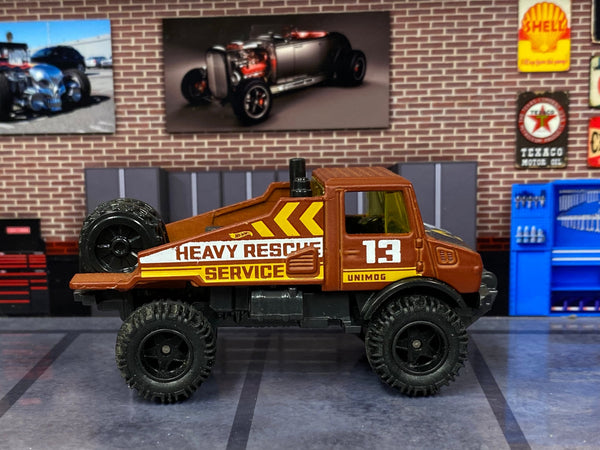 Brown No. 13 Mercedes-Benz Unimog custom Hot Wheels, left side with Heavy Rescue graphics