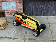 Custom Hot Wheels Mo-Stash cream, orange, and black #11 Mo-Stash livery with chrome wheels and rubber tires - three-quarter view