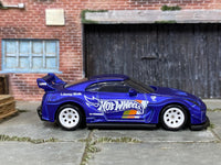 Satin-blue Nissan LB Works 35GT-RR custom Hot Wheels, side view with white mag wheels