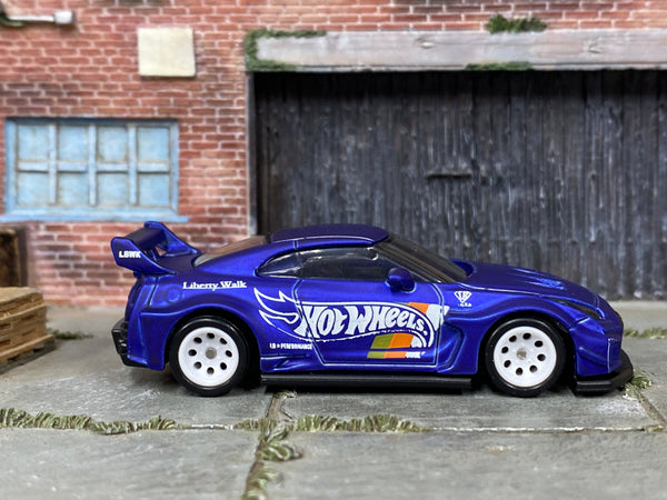 Satin-blue Nissan LB Works 35GT-RR custom Hot Wheels, side view with white mag wheels