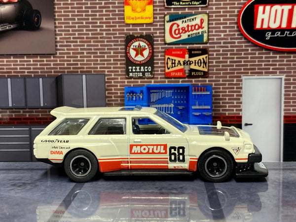 Ivory-white No. 68 Nissan Maxima Drift Car custom Hot Wheels, left side with Motul graphics