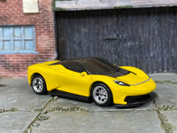 Satin-yellow Pininfarina Battista custom Hot Wheels, front-right view