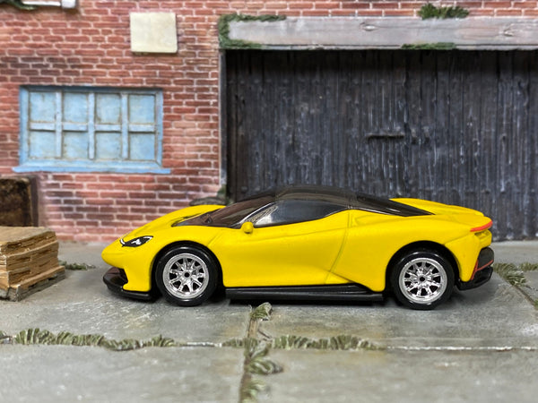 Satin-yellow Pininfarina Battista custom Hot Wheels, left-side view