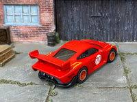 Satin-red Porsche 935 custom Hot Wheels number 70, rear three-quarter view