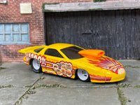 Custom Hot Wheels Pro Stock Pontiac Firebird in yellow KABOOM livery with white mag wheels and Hoosier drag slicks
