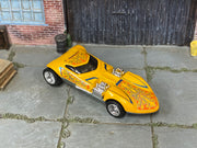 Custom Hot Wheels Screamin' Hauler yellow finish with orange flame graphics and exposed chrome engines with chrome wheels and rubber tires - three-quarter view