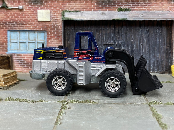 Custom Hot Wheels Speed Dozer metallic blue and silver Hot Wheels construction livery with chrome off-road wheels and rubber tires - side view
