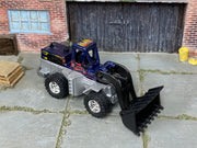 Custom Hot Wheels Speed Dozer metallic blue and silver Hot Wheels construction livery with chrome off-road wheels and rubber tires - three-quarter view