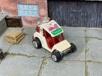 Cream-and-red Tee’d Off custom Hot Wheels, front view with Miller CC roof graphic