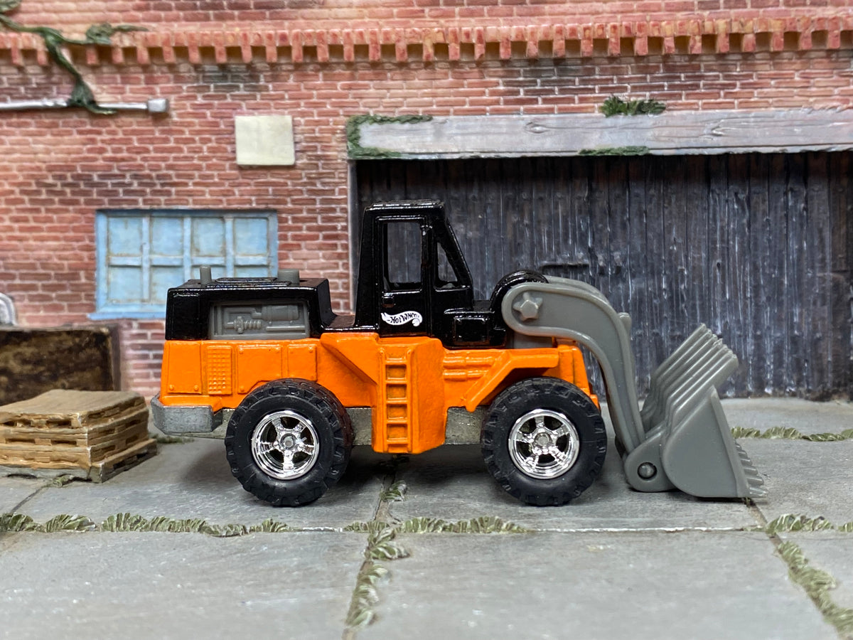 Custom Hot Wheels Wheel Loader – Orange/Black – Chrome Off-Road Wheels – Rubber Tires – side view