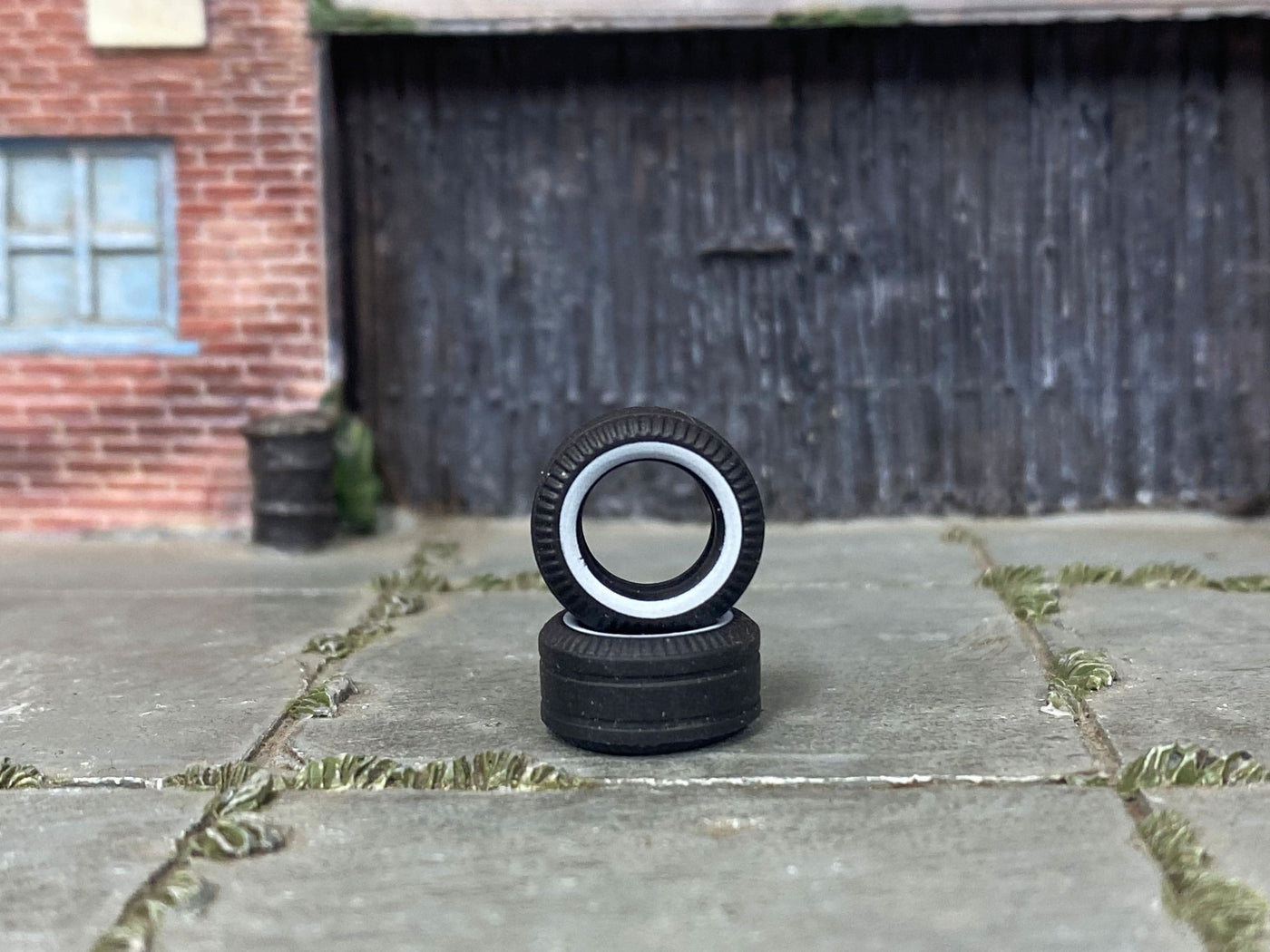 Two 13mm whitewall drag slick rubber tires shown without wheels
