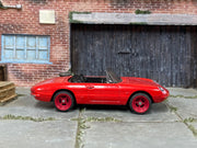 Custom Matchbox 1990 Mazda MX-5 Miata, Red with red wheels, side view
