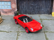 Custom Matchbox 1990 Mazda MX-5 Miata, Red with red wheels, three-quarter view