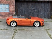 Custom Matchbox Mercedes-AMG SL 63, Metallic orange with white wheels, side view