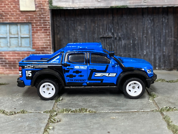 Custom Matchbox 2019 Chevy Colorado ZR2, MBX Rally #15 with white wheels, side view