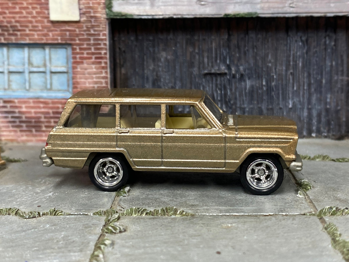 Custom Matchbox 1964 Jeep Wagoneer, Gold with chrome wheels, side view