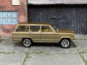 Custom Matchbox 1964 Jeep Wagoneer, Gold with chrome wheels, side view