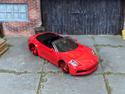 Custom Matchbox Porsche 911 Carrera Cabriolet, Red with red wheels, three-quarter view