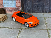 Custom Matchbox 2019 Volkswagen Beetle Convertible, Orange with chrome wheels, three-quarter view