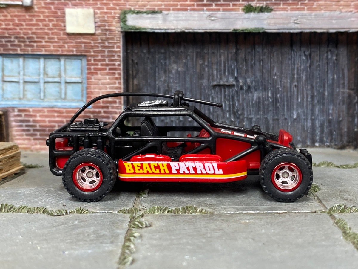 Custom Matchbox Dune Buggy, Beach Patrol with red off-road wheels, side view