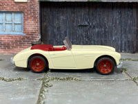 1963 Austin-Healey 3000 MK2 cream custom Matchbox with red wheels, view 1