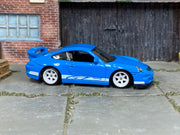 Custom Matchbox Porsche 911 GT3, Blue and white with white wheels, side view