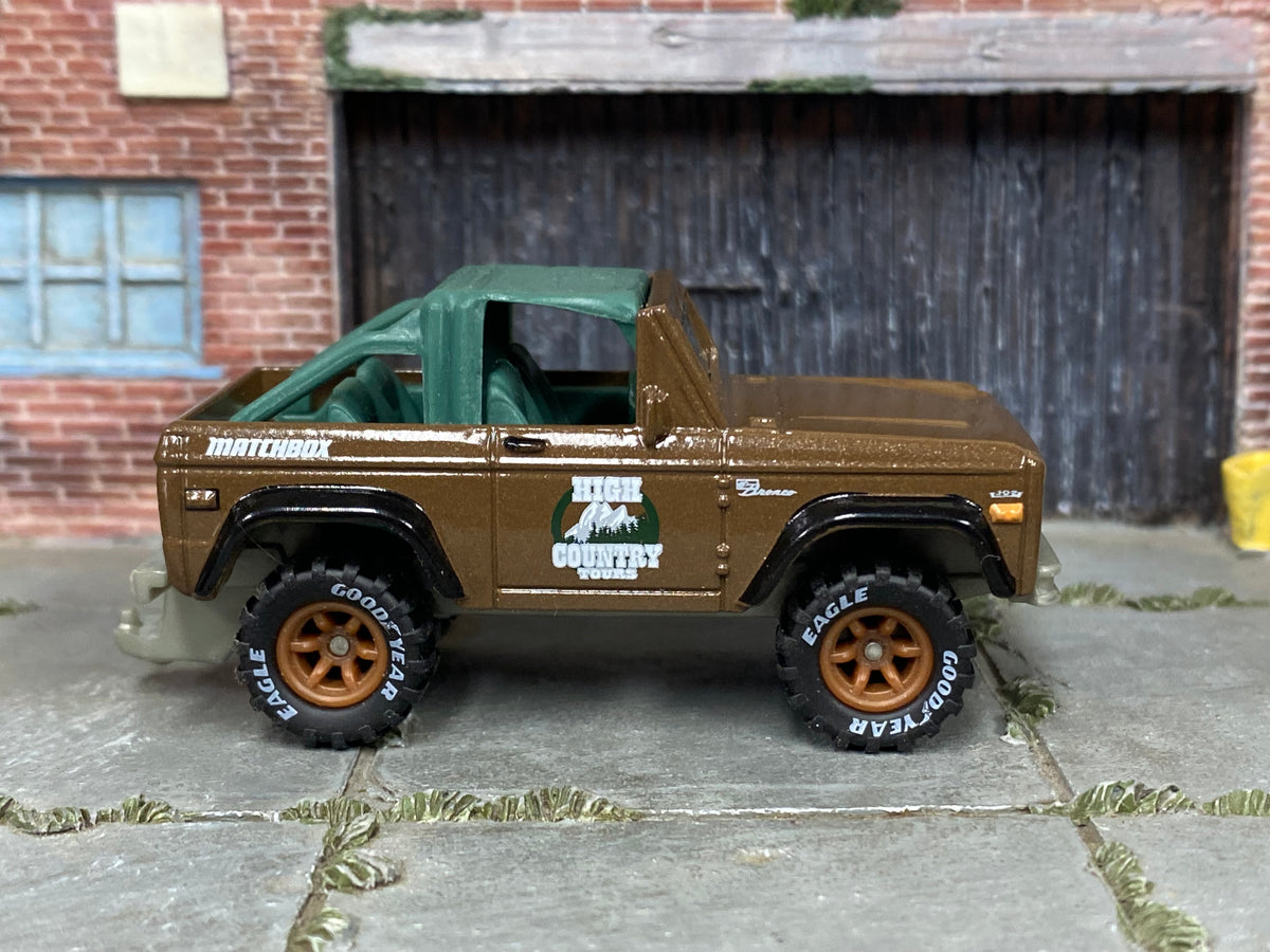 Custom Matchbox 1972 Ford Bronco 4x4, High Country Tours with printed Goodyear tires, side view