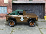 Custom Matchbox 1972 Ford Bronco 4x4, High Country Tours with printed Goodyear tires, side view