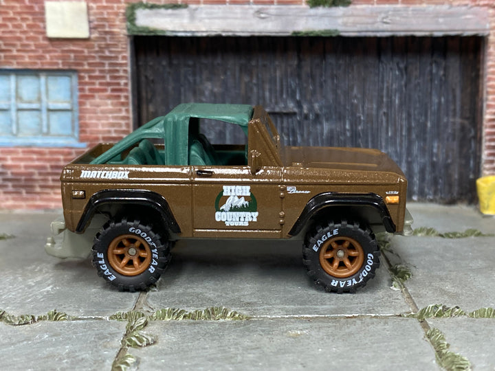Custom Matchbox 1972 Ford Bronco 4x4, High Country Tours with printed Goodyear tires, side view