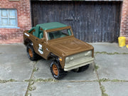 Custom Matchbox 1972 Ford Bronco 4x4, High Country Tours with printed Goodyear tires, three-quarter view