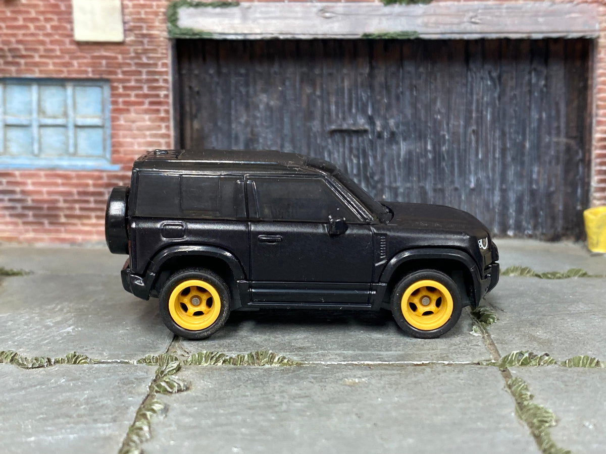 Custom Matchbox 2020 Land Rover Defender 90, Black with gold wheels, side view