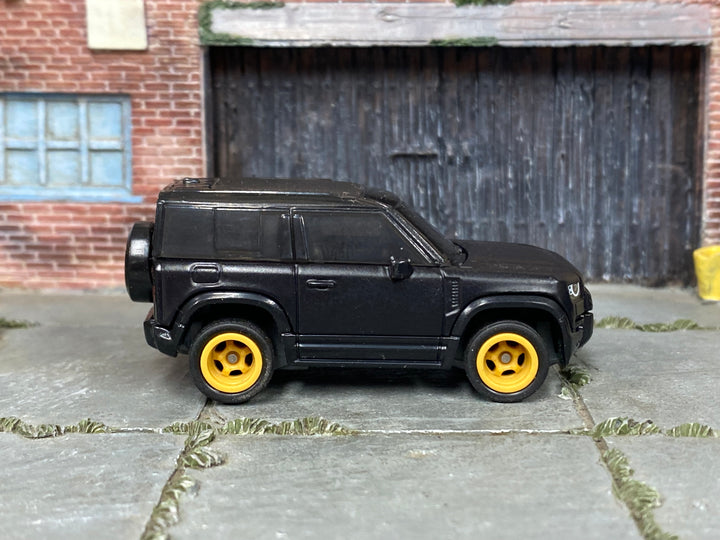 Custom Matchbox 2020 Land Rover Defender 90, Black with gold wheels, side view