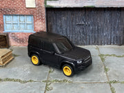 Custom Matchbox 2020 Land Rover Defender 90, Black with gold wheels, three-quarter view