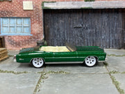 Custom Matchbox 1961 Lincoln Continental, Metallic green with white wheels, side view