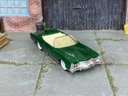 Custom Matchbox 1961 Lincoln Continental, Metallic green with white wheels, three-quarter view