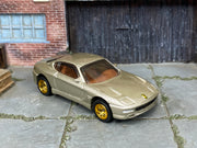 Custom Matchbox Ferrari 550 Maranello, Champagne with gold wheels, three-quarter view