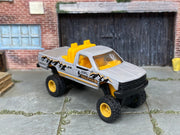 Custom Matchbox Chevy K-1500, Trail Hiker with yellow off-road wheels, three-quarter view