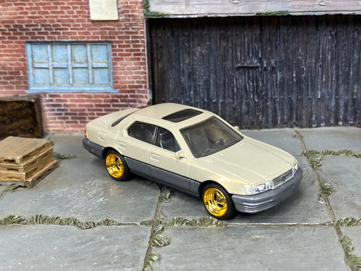 Custom Matchbox 1994 Lexus LS 400, Champagne with gold wheels, three-quarter view