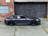 Porsche Panamera metallic-blue custom Matchbox with black wheels and rubber tires, view 1