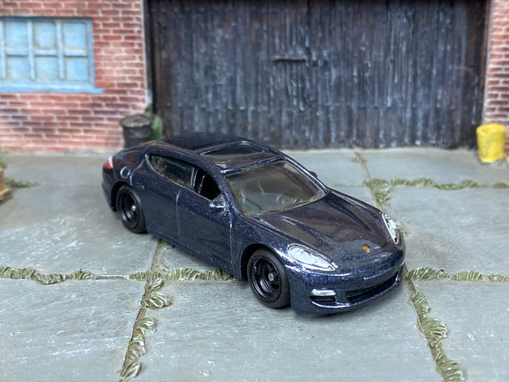 Custom Matchbox Porsche Panamera, Metallic blue with black wheels, three-quarter view