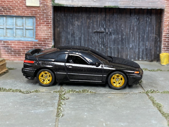 Custom Matchbox Subaru SVX, Black with gold wheels, side view