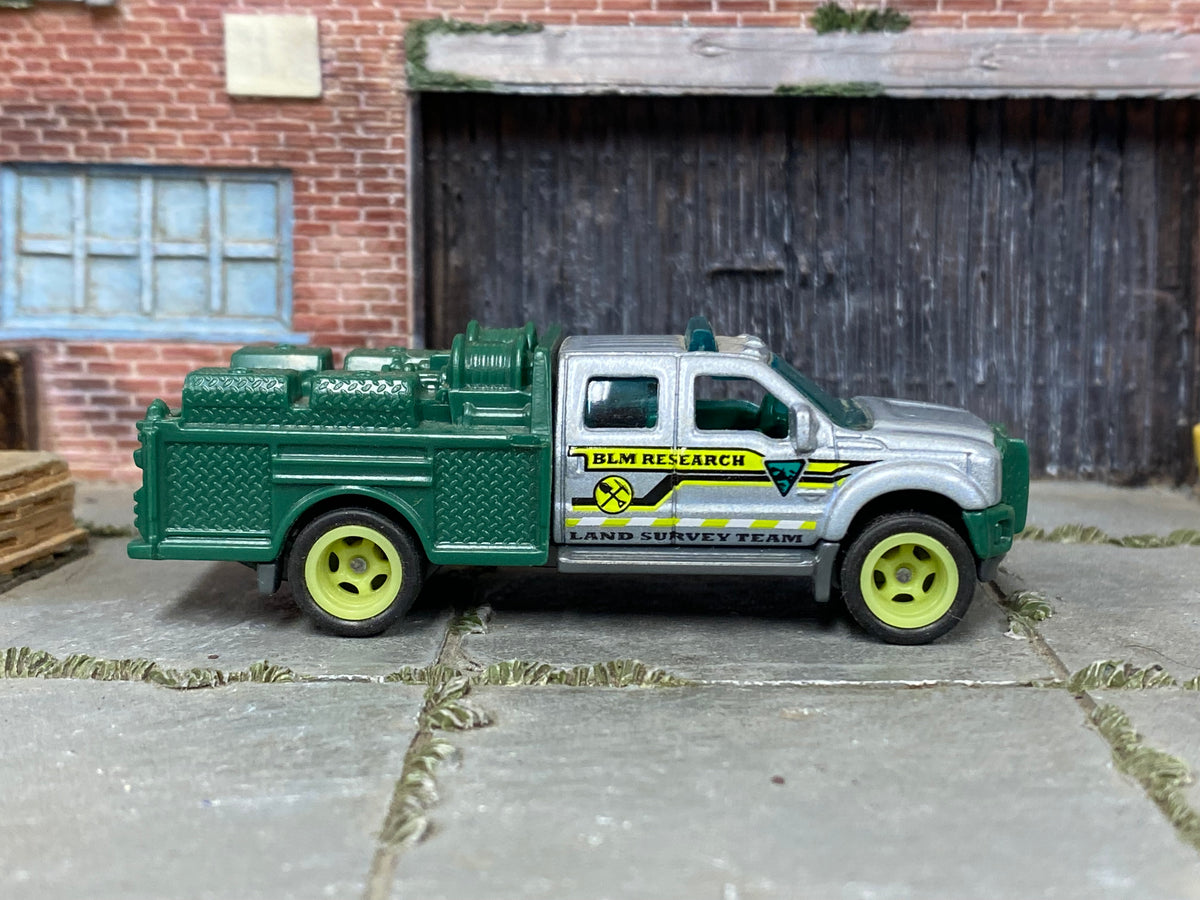 Custom Matchbox Ford F-550 Super Duty, BLM Research with lime green wheels, side view