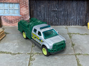Custom Matchbox Ford F-550 Super Duty, BLM Research with lime green wheels, three-quarter view